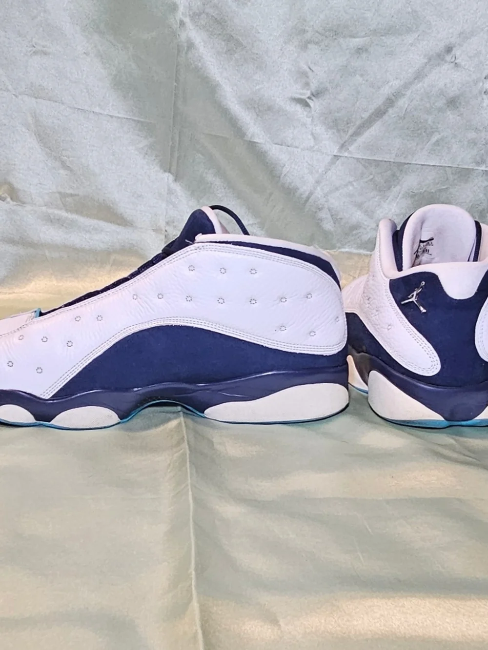 Air Jordan Retro Basketball Sneakers in White and Navy with Teal Accents